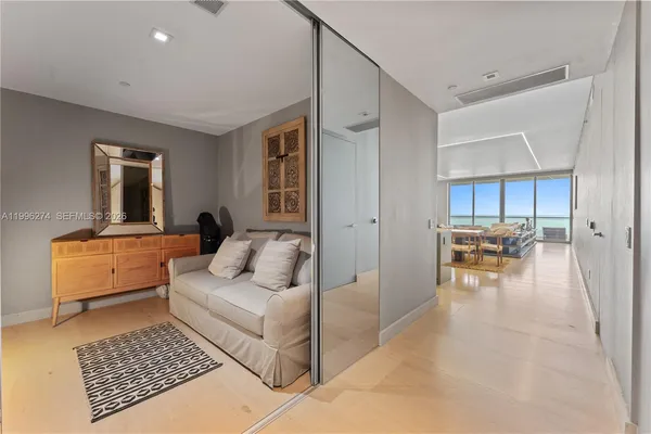 a front view of a residential apartment building with a yard