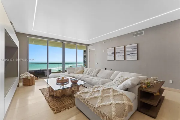 a living room with furniture and a large window