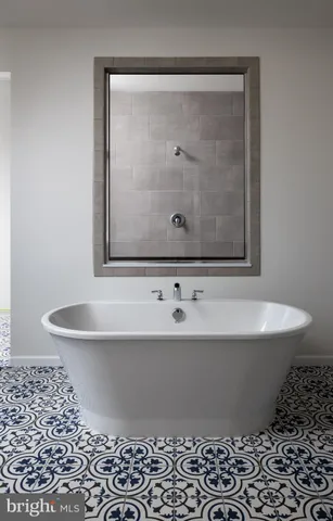 a white bath tub sitting in a bathroom