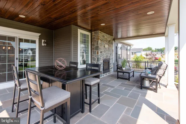 a outdoor dining space with furniture and outdoor view