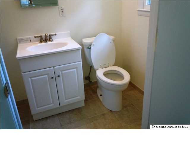 25 Kenmore Road Freehold, NJ 07728 - Photo 8 of 12 a bathroom with a sink and a toilet