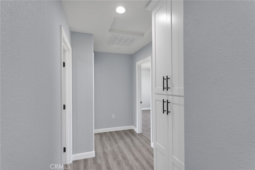 36165 Sutter Road Lucerne Valley, CA 92356 - Photo 15 of 42 wooden floor in a hall with an entryway
