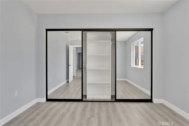 a view of front door with wooden floor
