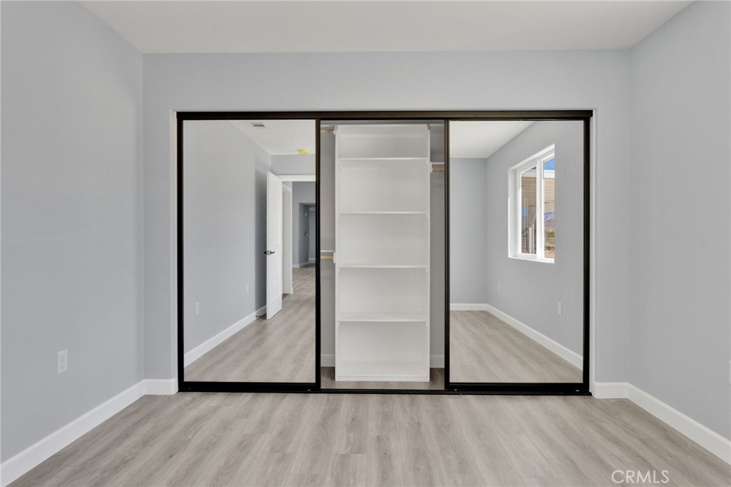 36165 Sutter Road Lucerne Valley, CA 92356 - Photo 16 of 42 a view of front door with wooden floor