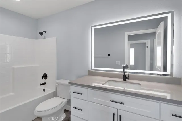 a bathroom with a sink a toilet and a bathtub