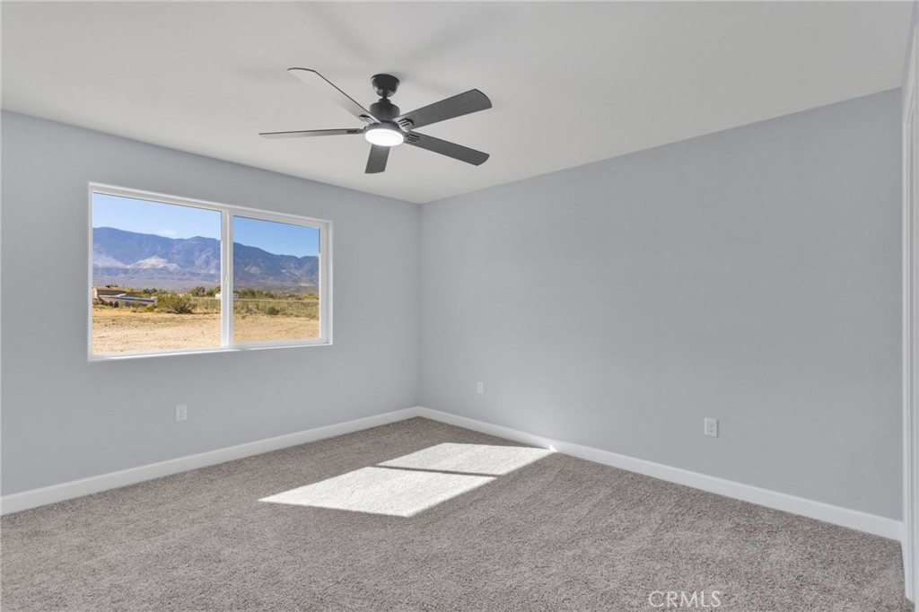 36165 Sutter Road Lucerne Valley, CA 92356 - Photo 25 of 42 a view of an empty room with a window