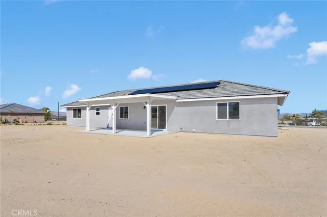 a big house with a big yard and large trees