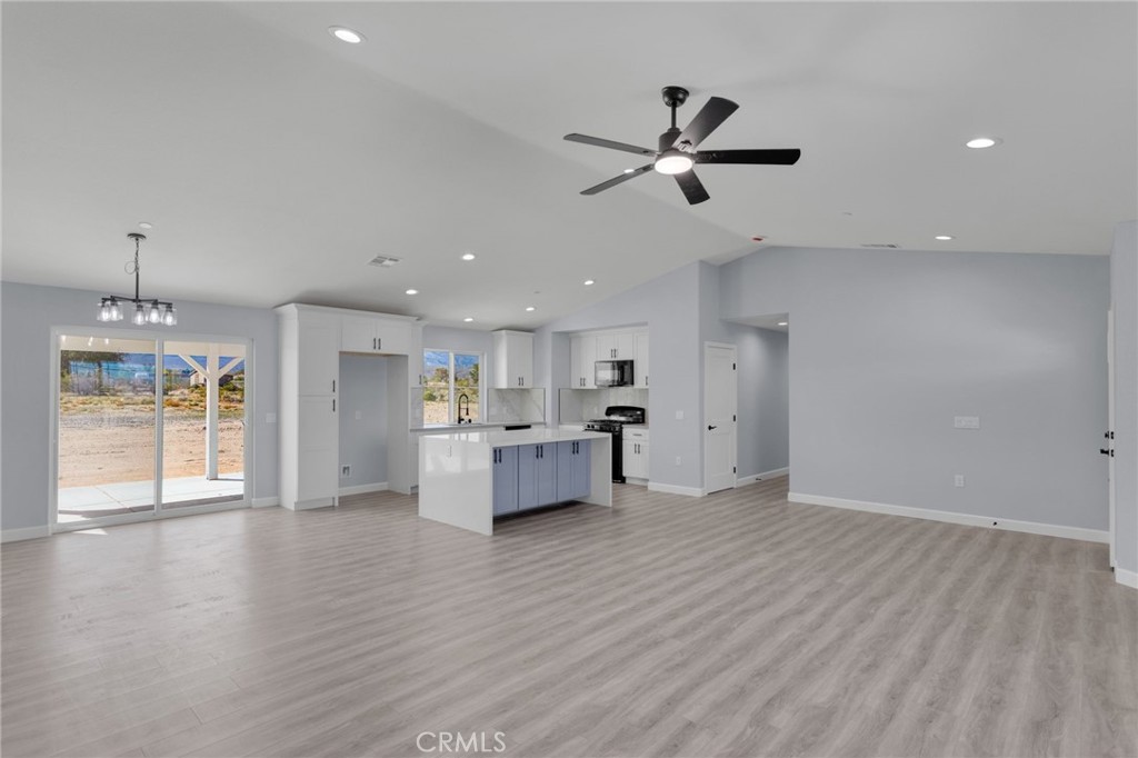 36165 Sutter Road Lucerne Valley, CA 92356 - Photo 9 of 42 a view of a kitchen with window and stainless steel appliances