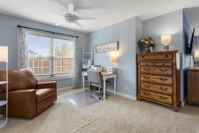 a living room with furniture and a window