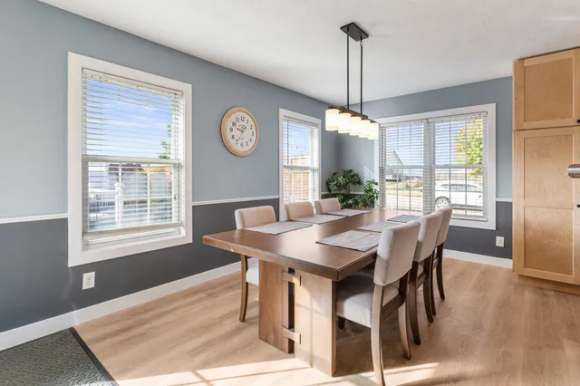 a view of a dining room with furniture window and wooden floor