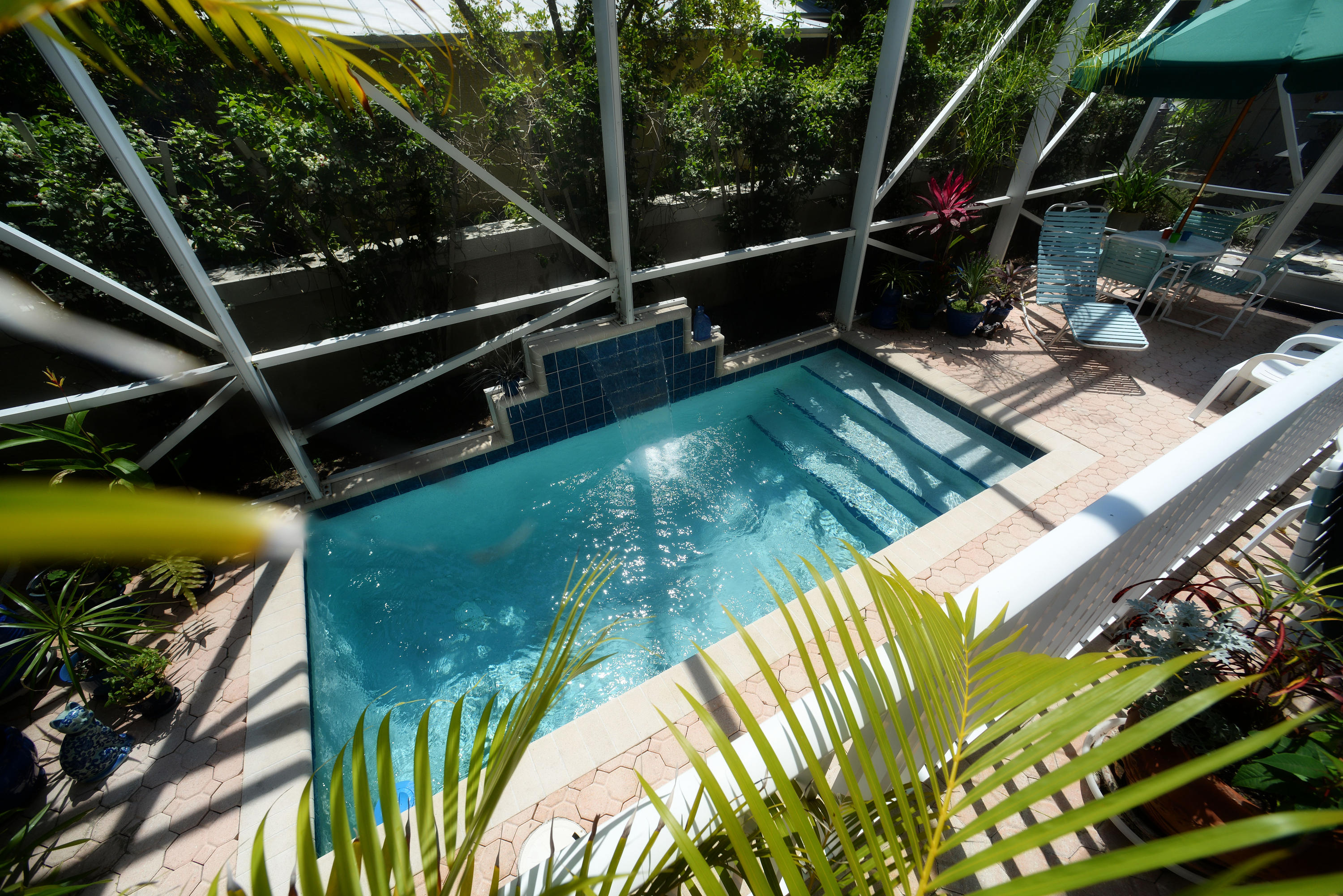 481 Olympus Drive, Unit 201 Juno Beach, FL 33408 - Photo 14 of 23 a view of a balcony with chairs