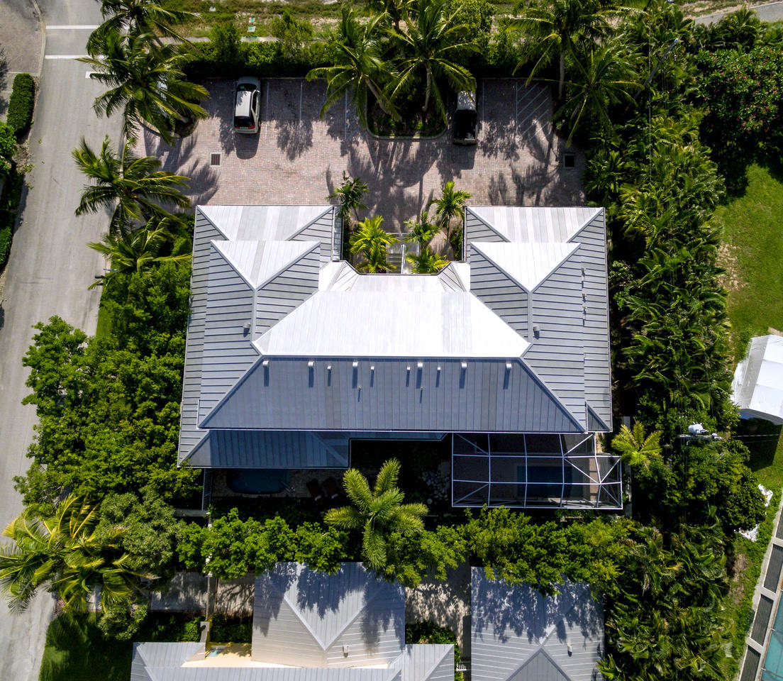 481 Olympus Drive, Unit 201 Juno Beach, FL 33408 - Photo 16 of 23 a view of a house with potted plants