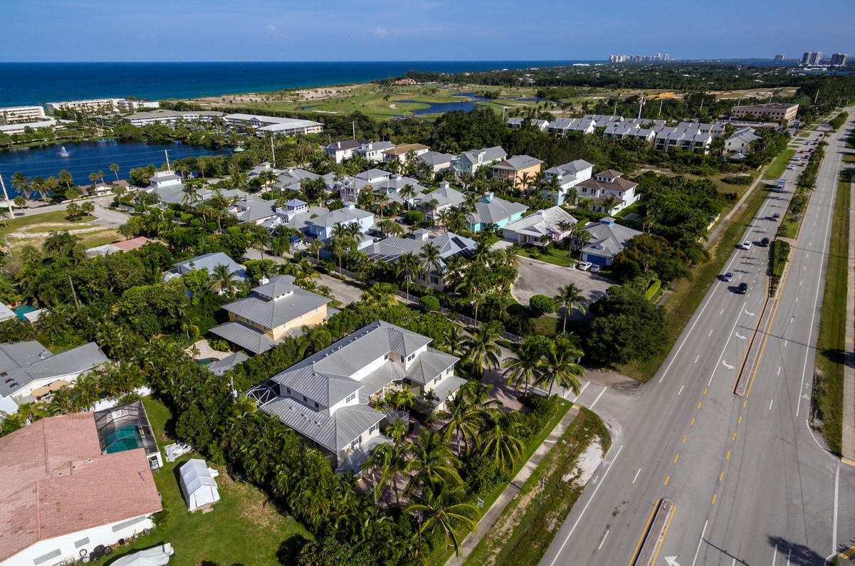 481 Olympus Drive, Unit 201 Juno Beach, FL 33408 - Photo 18 of 23 an aerial view of multiple house