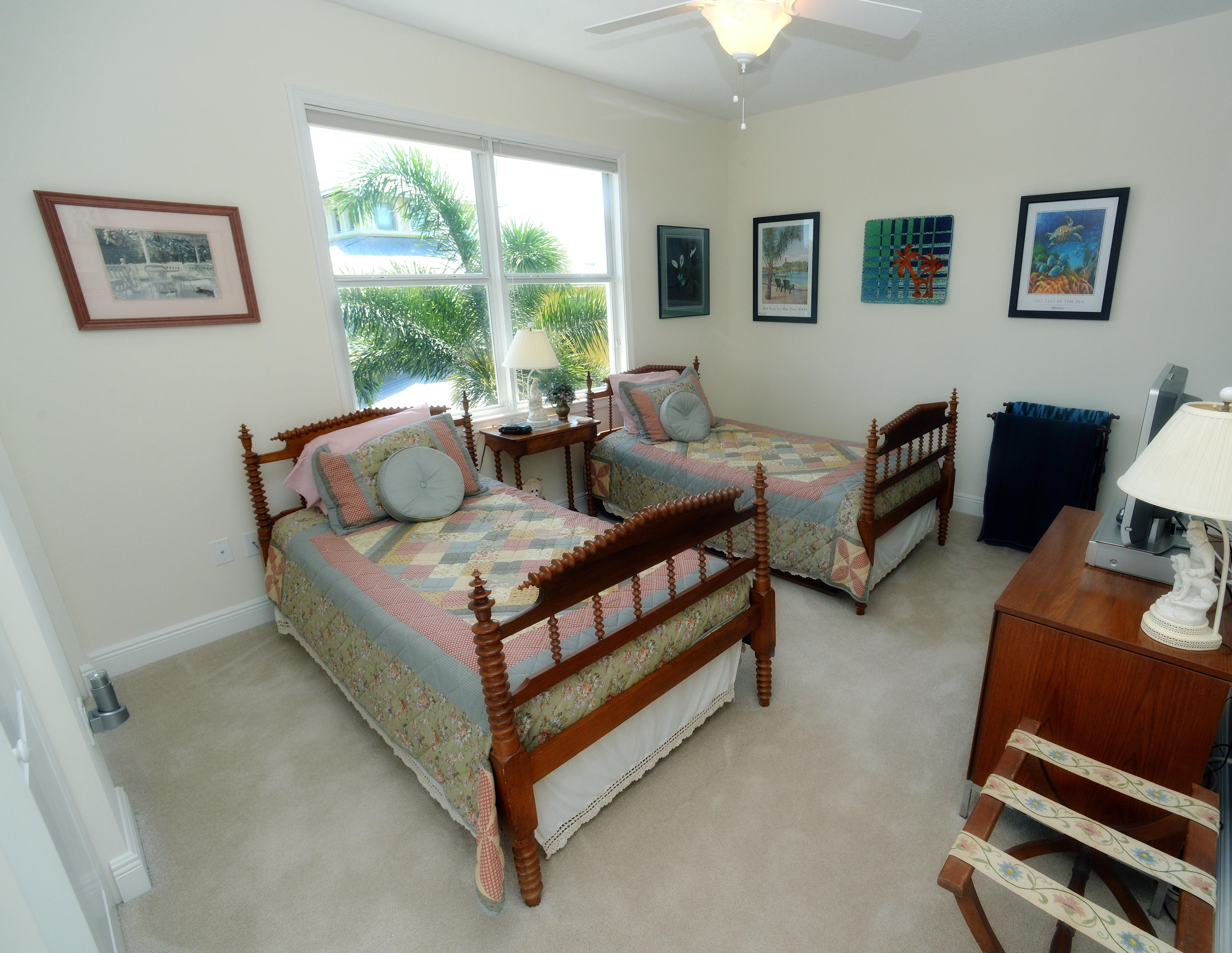 481 Olympus Drive, Unit 201 Juno Beach, FL 33408 - Photo 9 of 23 a living room with furniture and a window
