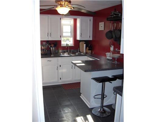 336 Nichols Road Pittsburgh, PA 15237 - Photo 3 of 14 Kitchen. Tastefully updated with new flooring and countertops, refinished cabinets, and a peninsula for eating.