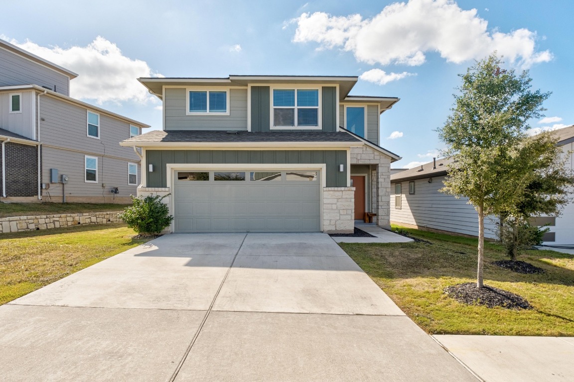 7709 Jacobean Way Austin, TX 78724 - Photo 1 of 23 a view of a white house with a swimming pool and sitting area