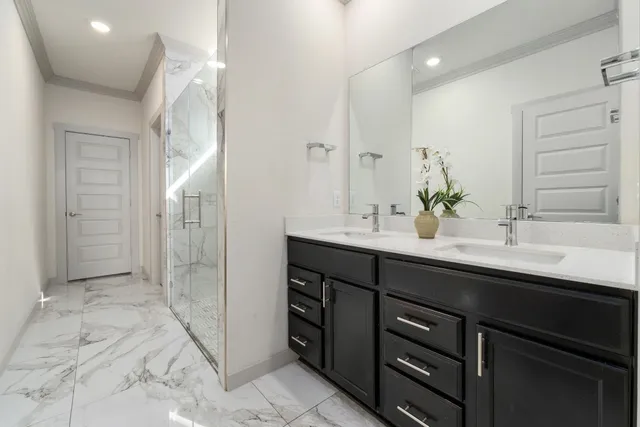 a bathroom with a double vanity sink mirror and double