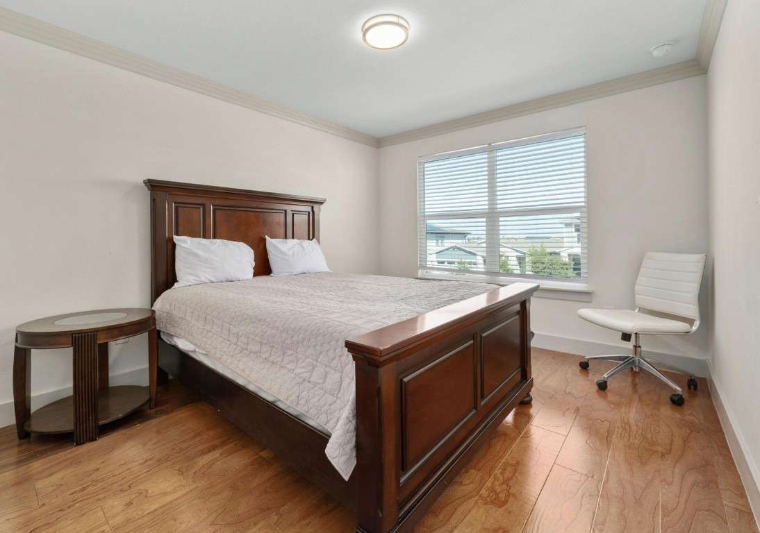 7709 Jacobean Way Austin, TX 78724 - Photo 17 of 23 a bedroom with a bed and a desk