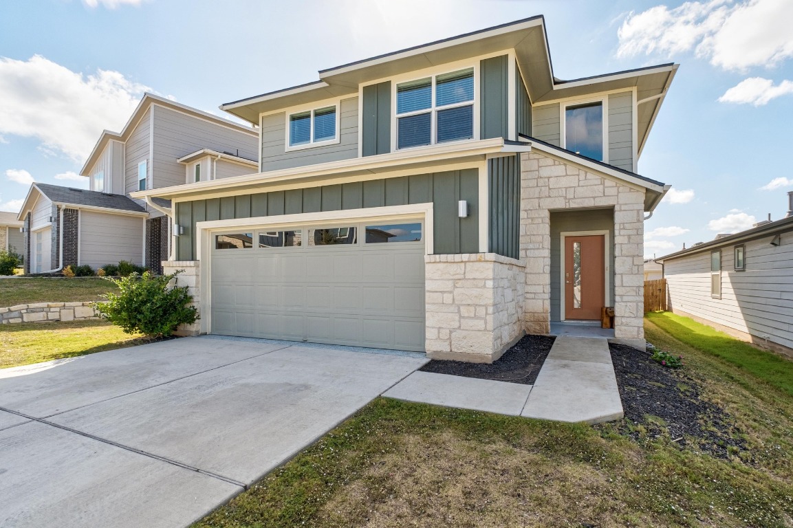 7709 Jacobean Way Austin, TX 78724 - Photo 2 of 23 a front view of a house with garden