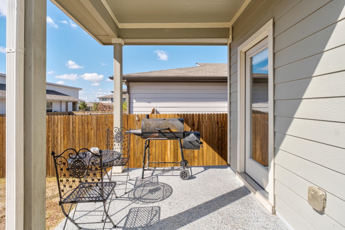 7709 Jacobean Way Austin, TX 78724 - Photo 23 of 23 a view of a balcony with chairs and potted plants