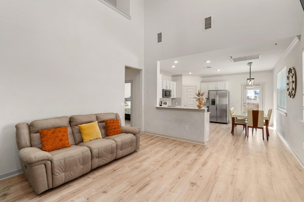 7709 Jacobean Way Austin, TX 78724 - Photo 3 of 23 a living room with furniture and kitchen view