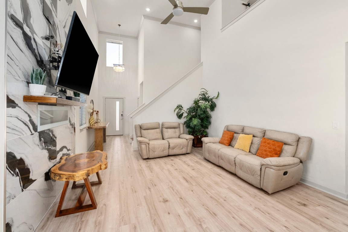 7709 Jacobean Way Austin, TX 78724 - Photo 4 of 23 a living room with furniture and a flat screen tv