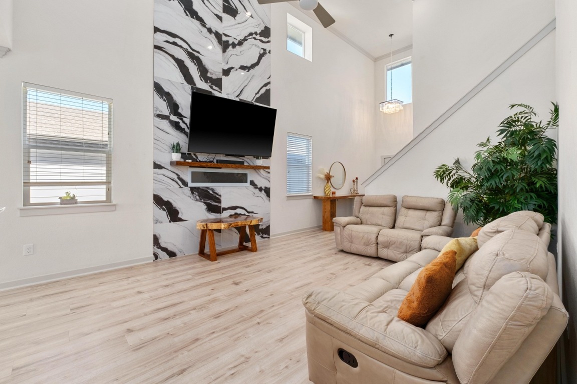 7709 Jacobean Way Austin, TX 78724 - Photo 5 of 23 a living room with furniture and a flat screen tv