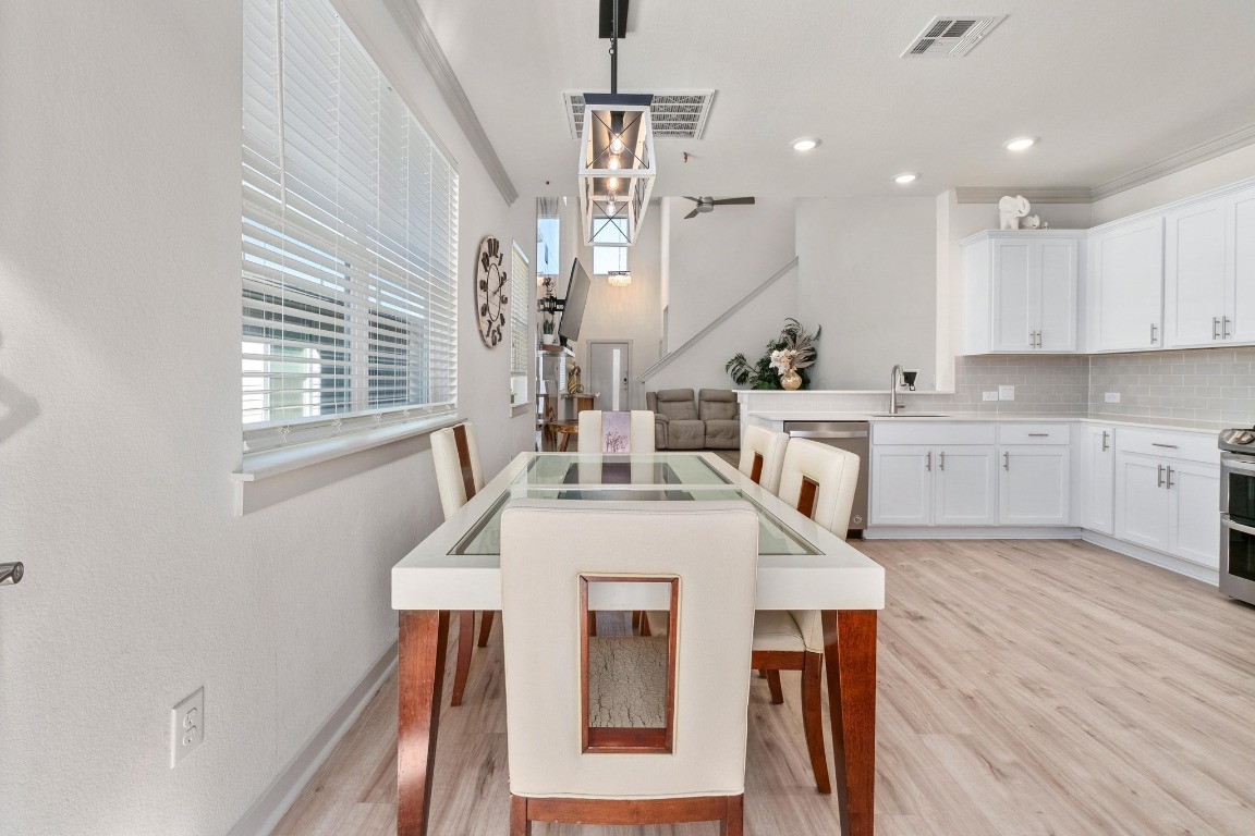 7709 Jacobean Way Austin, TX 78724 - Photo 10 of 23 a view of kitchen with cabinets and wooden floor