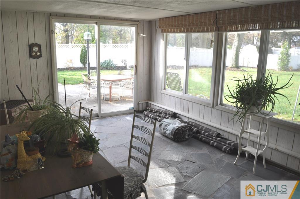 168 Colonia Road Colonia, NJ 07067 - Photo 13 of 23 a living room with furniture and large windows
