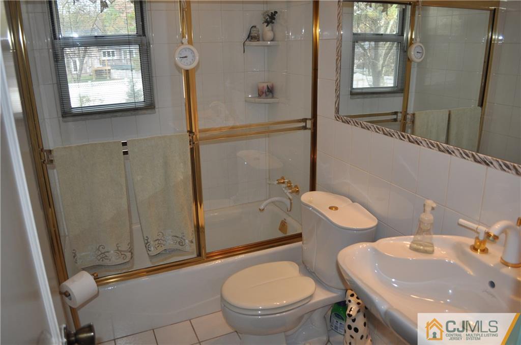 168 Colonia Road Colonia, NJ 07067 - Photo 19 of 23 a bathroom with a sink toilet and shower