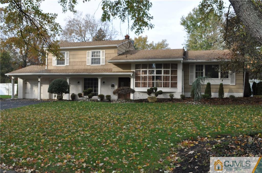 168 Colonia Road Colonia, NJ 07067 - Photo 3 of 23 front view of a house with a yard
