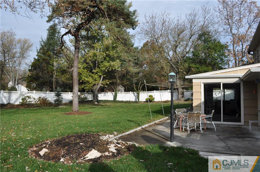 168 Colonia Road Colonia, NJ 07067 - Photo 21 of 23 a view of a house with backyard sitting area and garden