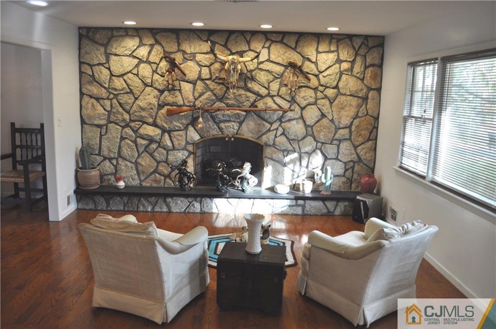 168 Colonia Road Colonia, NJ 07067 - Photo 5 of 23 a living room with furniture and a wall painting