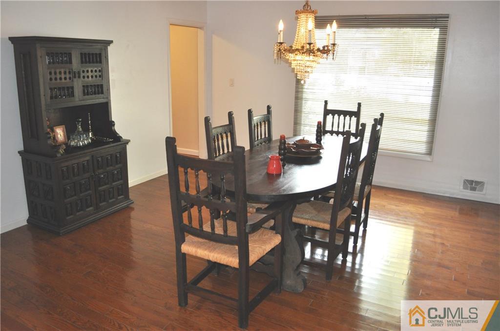 168 Colonia Road Colonia, NJ 07067 - Photo 7 of 23 a view of a dining room with furniture window and wooden floor