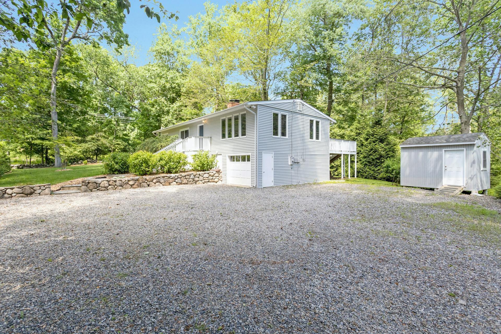 5 Wakerobin Road Norwalk, CT 06851 - Photo 27 of 27 Large driveway accommodates guest parking. Shed for additional storage.
