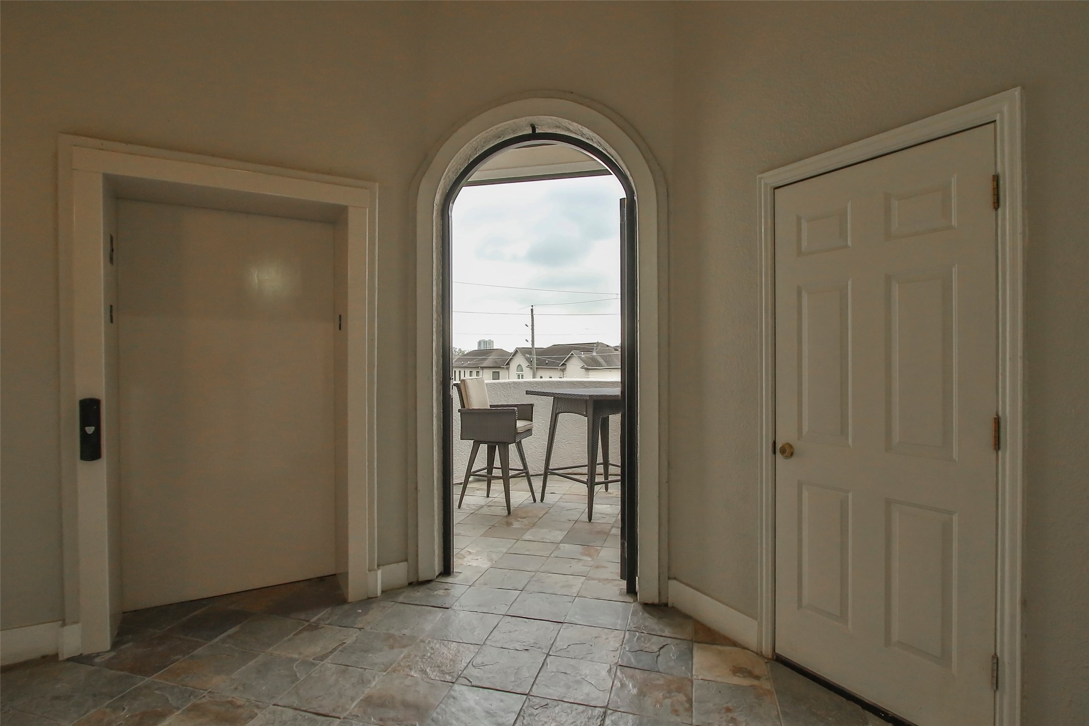 2701 Helena Street, Unit 302 Houston, TX 77006 - Photo 13 of 14 a view of a hallway and an dining rom with furniture