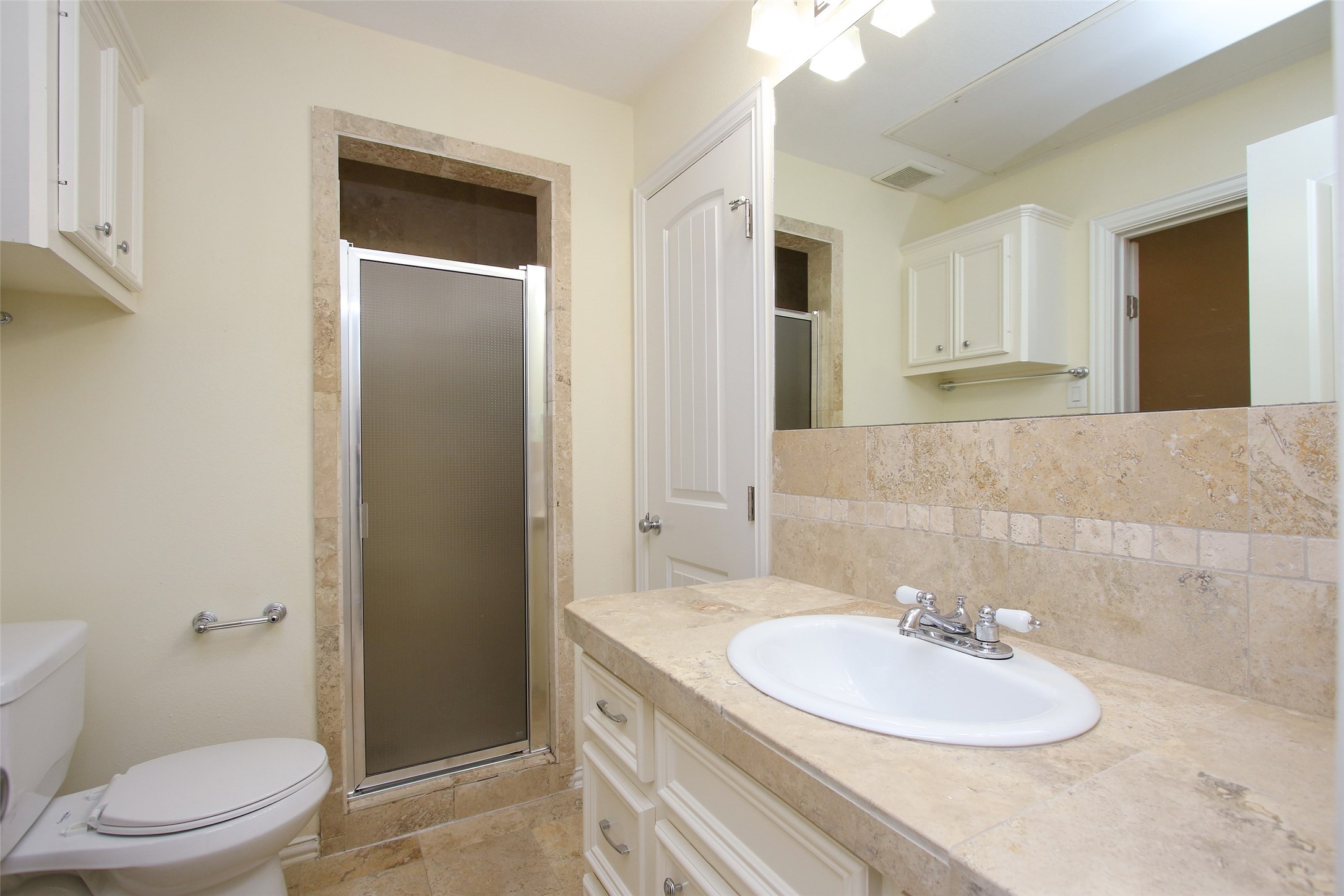 2701 Helena Street, Unit 302 Houston, TX 77006 - Photo 6 of 14 a bathroom with a sink a toilet and shower