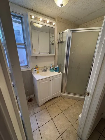 a utility room with cabinets washer and dryer