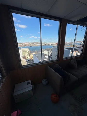 a room with furniture and a window