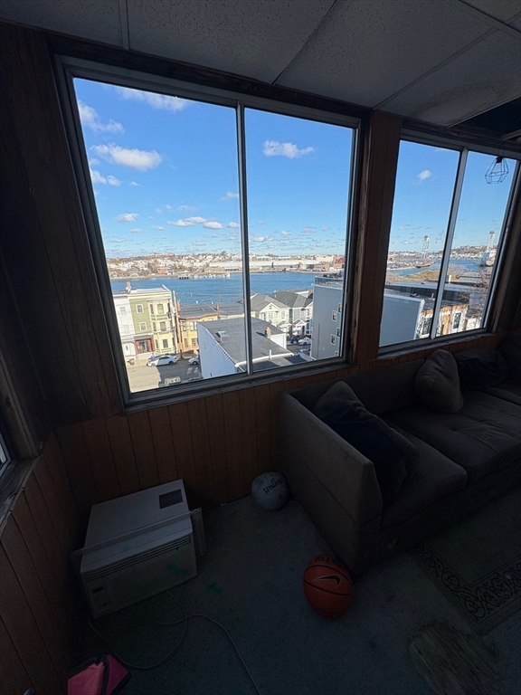 220 East Eagle Street, Unit 3 Boston, MA 02128 - Photo 6 of 6 a room with furniture and a window