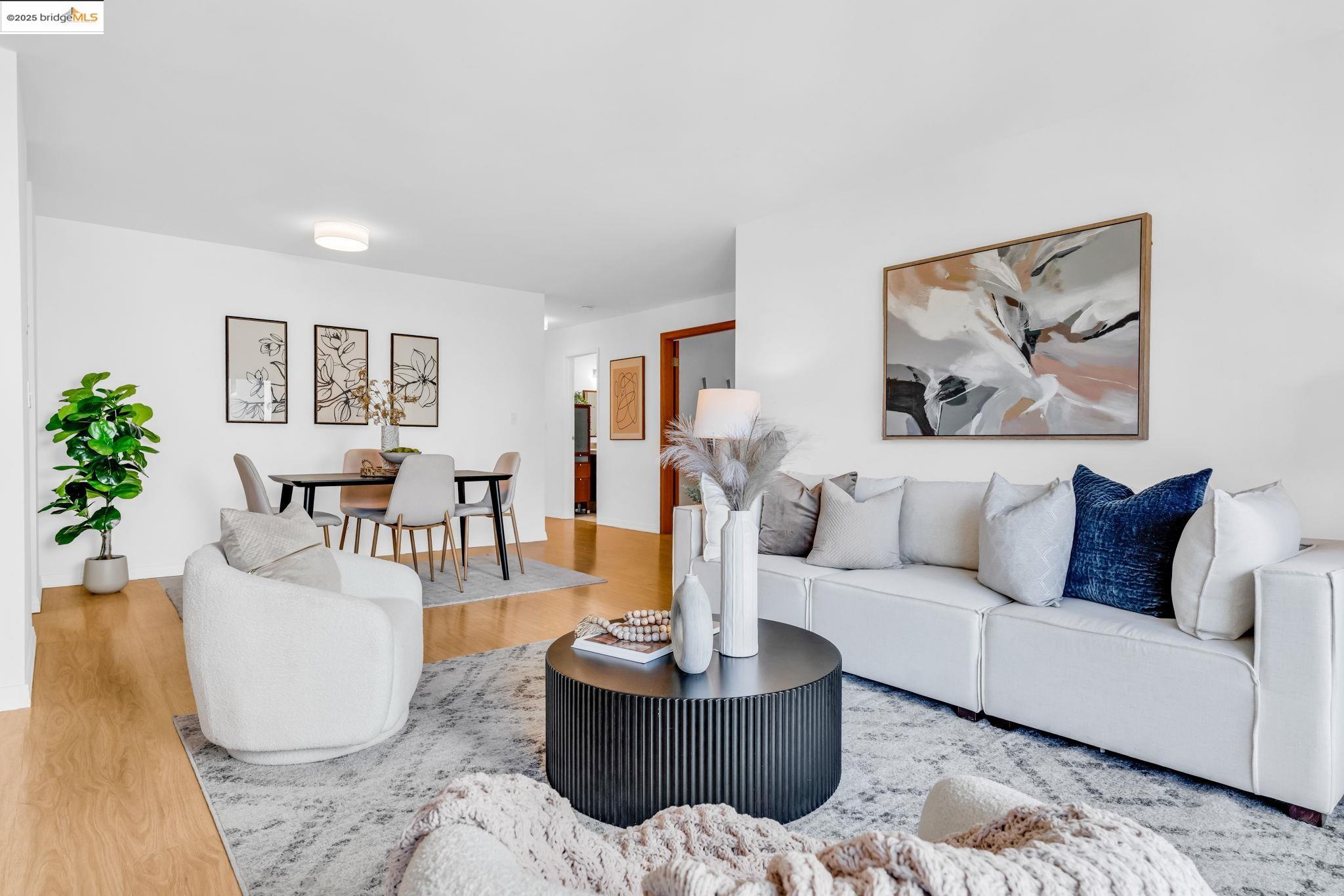 288 Whitmore Street, Unit 220 Oakland, CA 94611 - Photo 13 of 38 Living room featuring wood finished floors