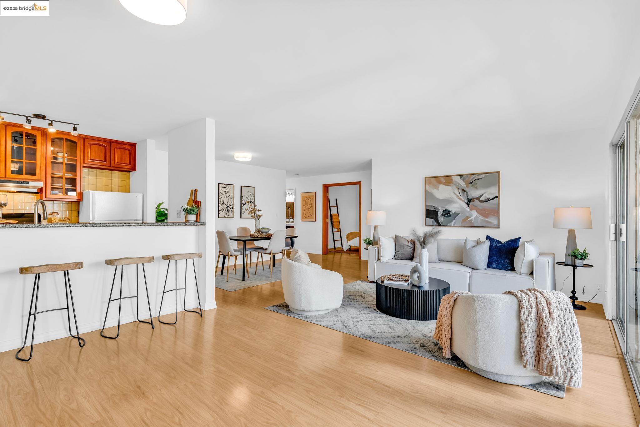 288 Whitmore Street, Unit 220 Oakland, CA 94611 - Photo 14 of 38 Living area with light wood-style flooring