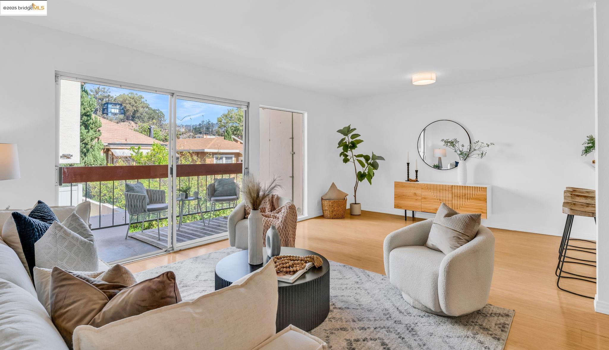 288 Whitmore Street, Unit 220 Oakland, CA 94611 - Photo 2 of 38 Living area with light wood-style floors and baseboards