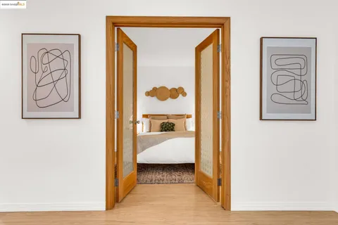 a en suite bathroom with a shower and a mirror