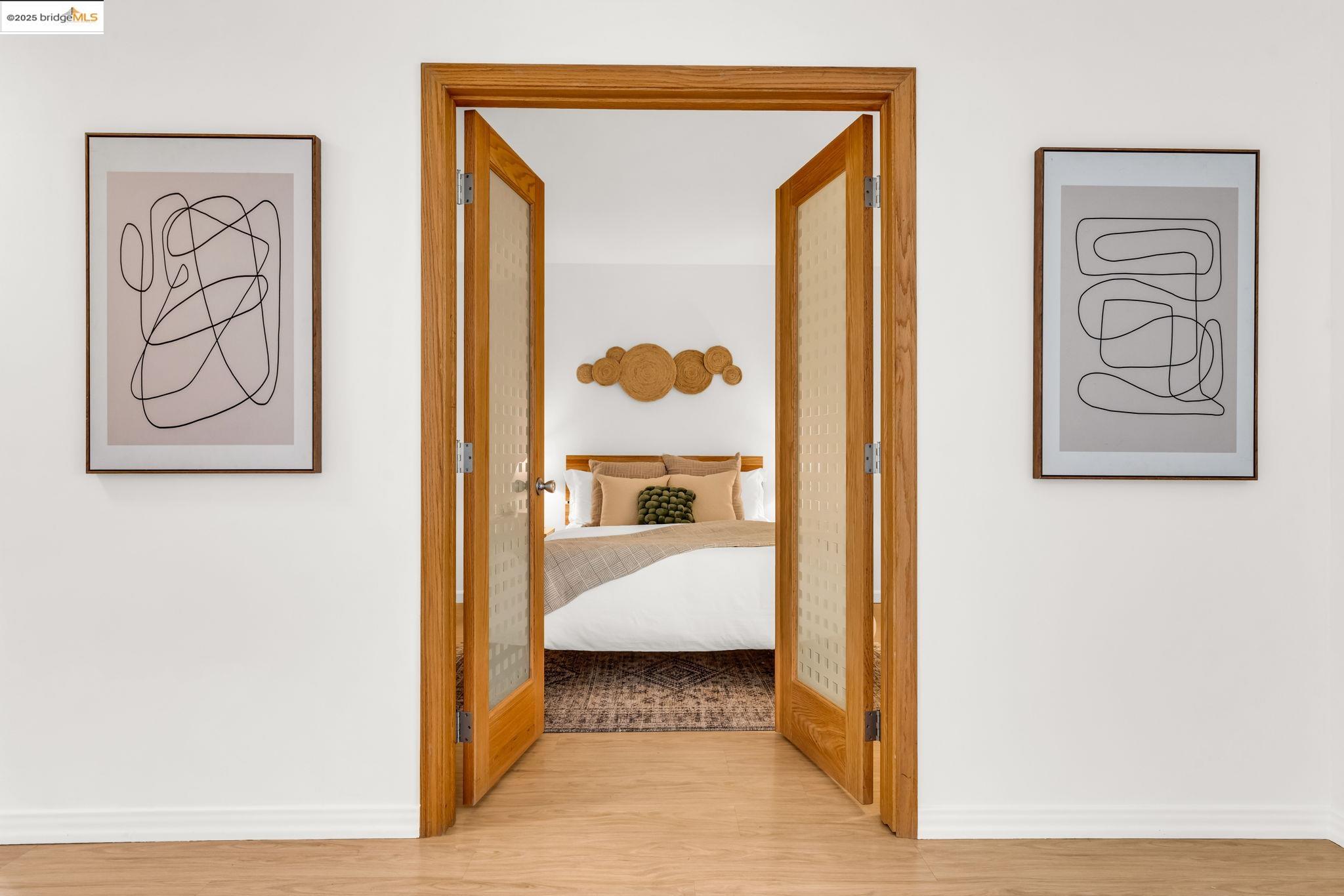 288 Whitmore Street, Unit 220 Oakland, CA 94611 - Photo 23 of 38 Corridor featuring light wood-type flooring and baseboards