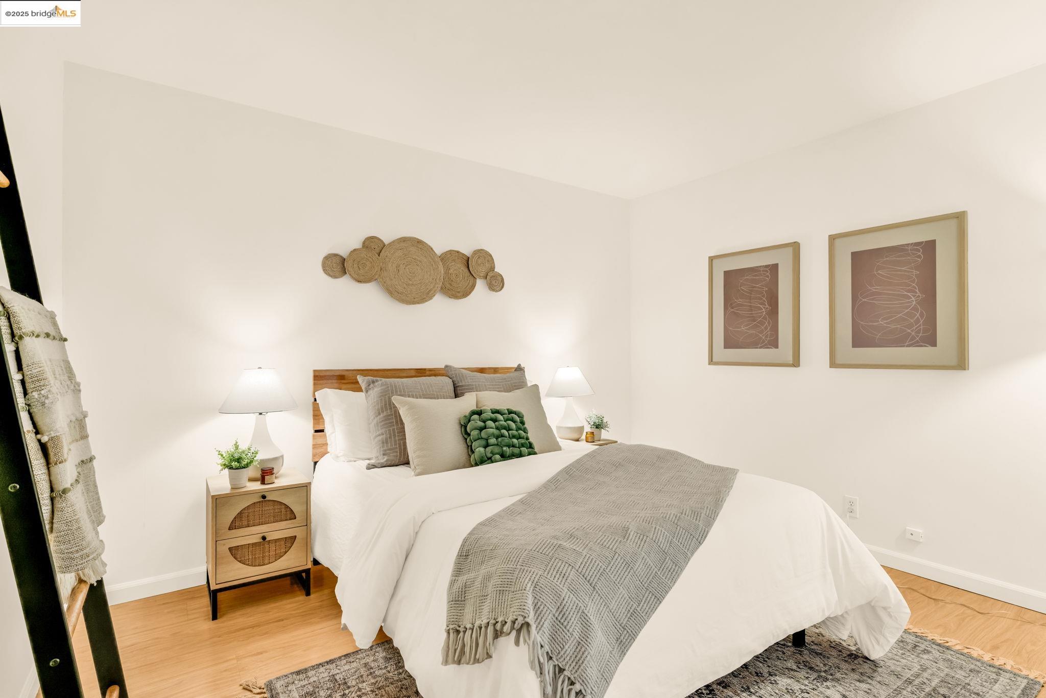 288 Whitmore Street, Unit 220 Oakland, CA 94611 - Photo 24 of 38 Bedroom with light wood-style floors and baseboards