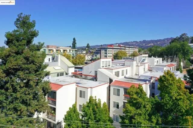 a view of a patio with table and chairs and potted plants
