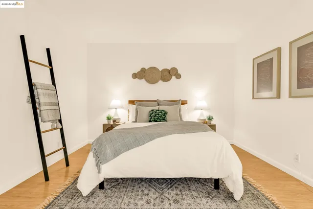 a bed sitting in a bedroom next to a small yard