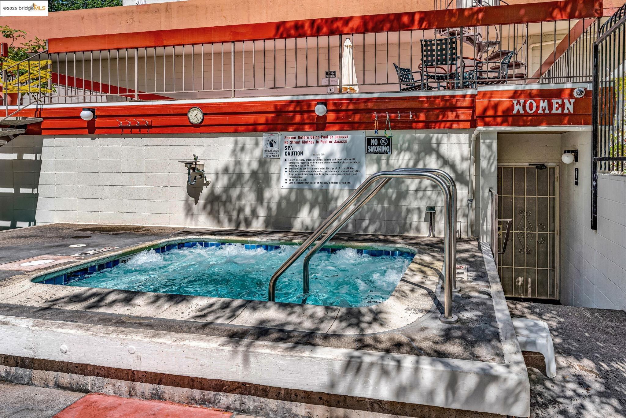 288 Whitmore Street, Unit 220 Oakland, CA 94611 - Photo 8 of 38 View of swimming pool with a hot tub