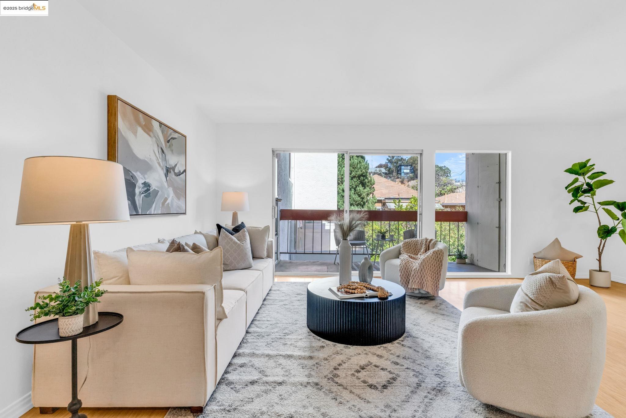 288 Whitmore Street, Unit 220 Oakland, CA 94611 - Photo 9 of 38 Living room featuring wood finished floors and baseboards